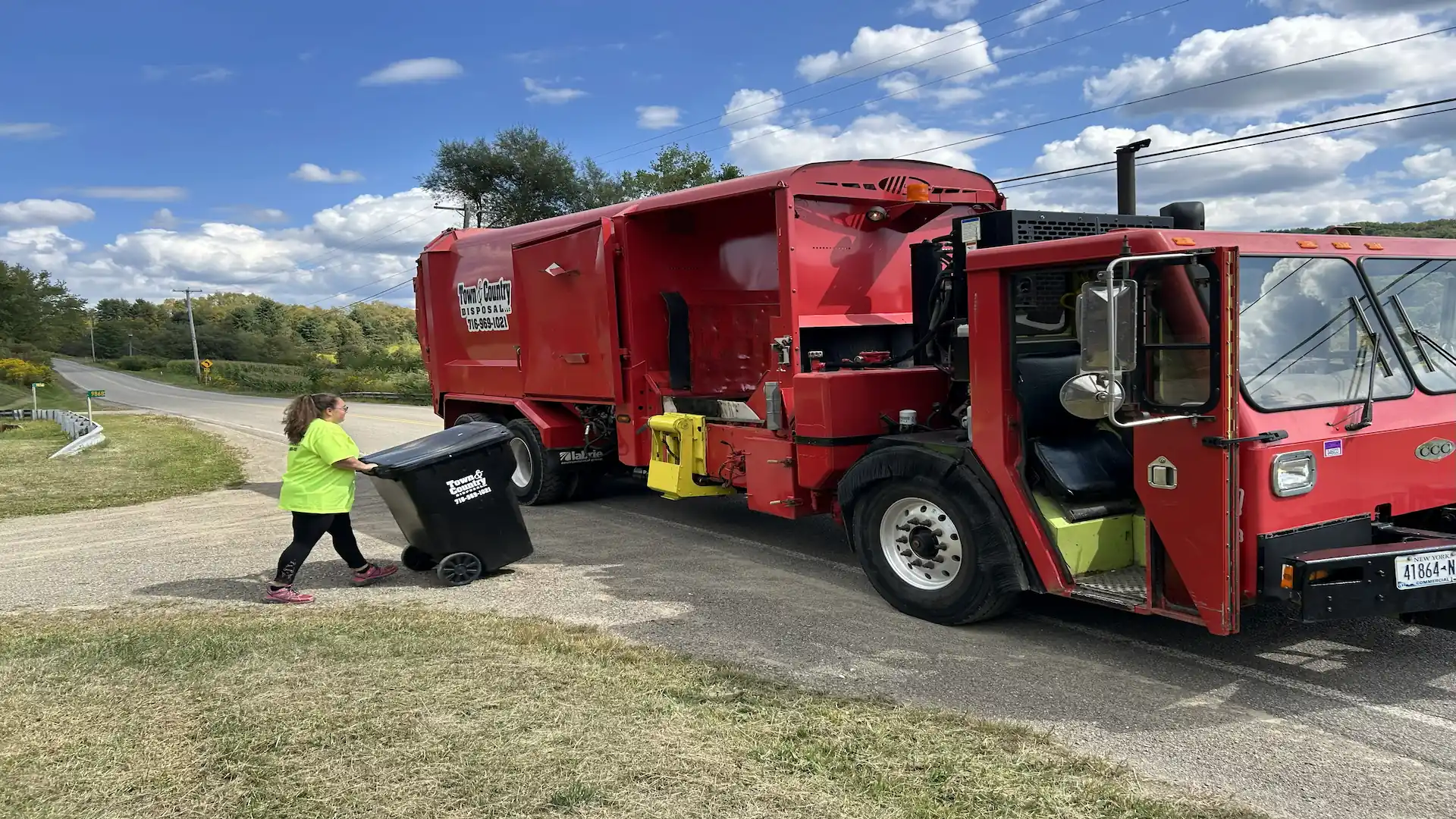 Town & Country Disposal truck providing residential trash pickup in Western New York - Weekly curbside trash collection with 96-gallon cart